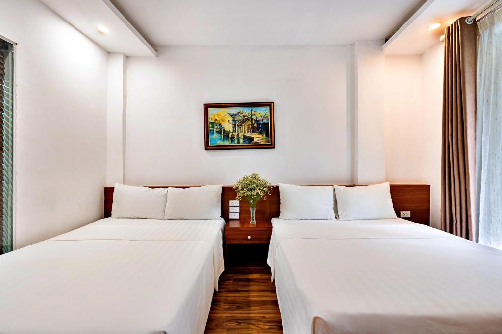 Postel nebo postele na pokoji v ubytování S79 Ami Hotel