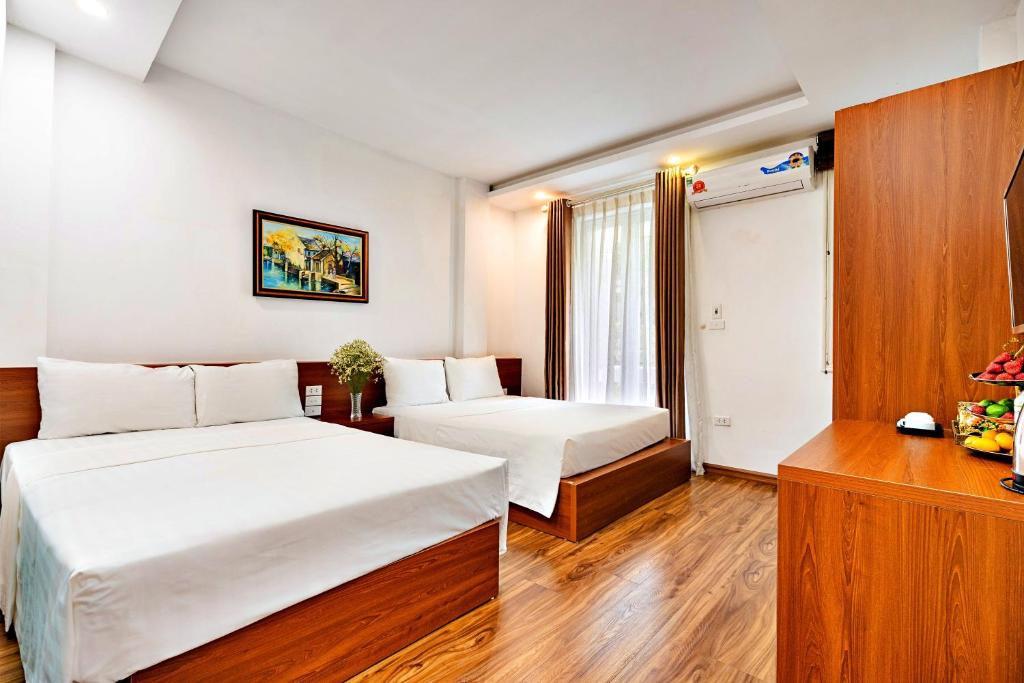 Postel nebo postele na pokoji v ubytování S79 Ami Hotel