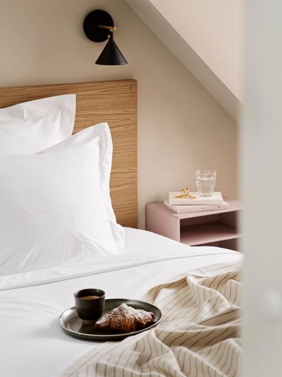 Voodi või voodid majutusasutuse Aura Apartment Hotel toas