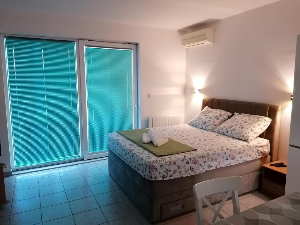 Postel nebo postele na pokoji v ubytování Apartment Buki
