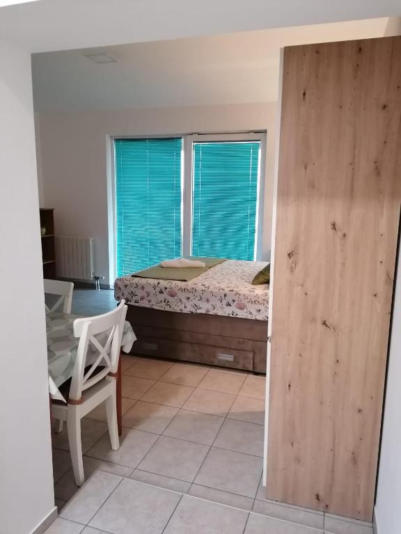 Postel nebo postele na pokoji v ubytování Apartment Buki
