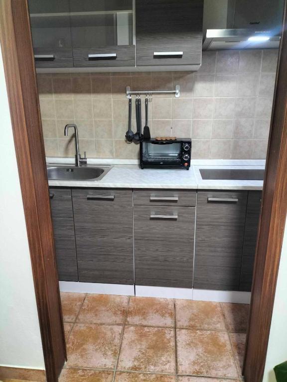 Kuchyň nebo kuchyňský kout v ubytování SIM residence
