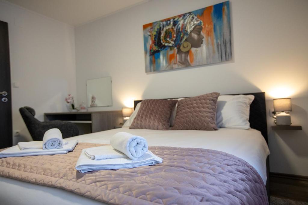 Postel nebo postele na pokoji v ubytování APARTMANI TEA