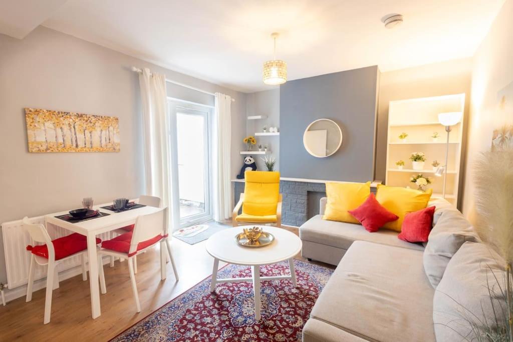 a living room with a couch and a table at Stylish 1-Bed Flat in Bristol in Bristol