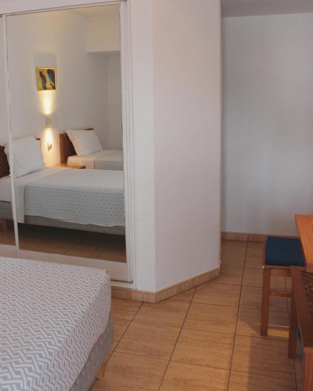 Postel nebo postele na pokoji v ubytování Vegas Residence - Adults Only