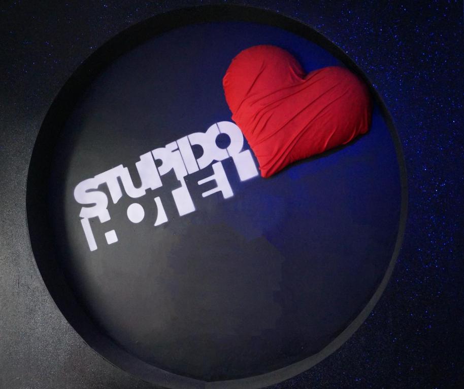 a heart on avisor with the words stupid hotter at Stupido Hotel Rimini in Rimini