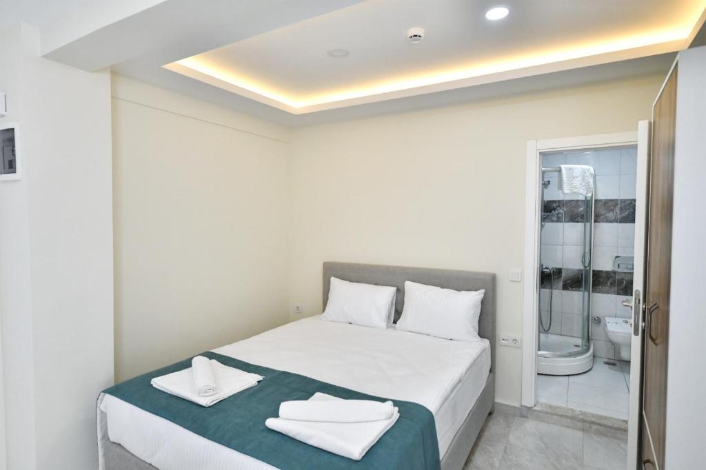 Postel nebo postele na pokoji v ubytování Lamira Apart Holiday&Guest House