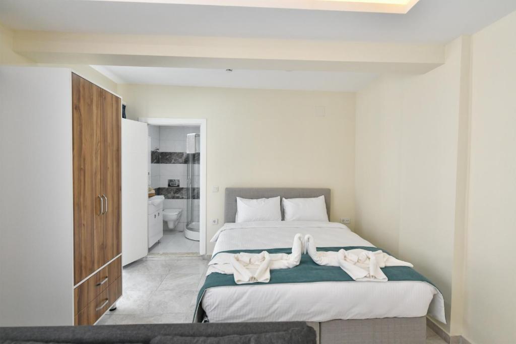 Postel nebo postele na pokoji v ubytování Lamira Apart Holiday&Guest House