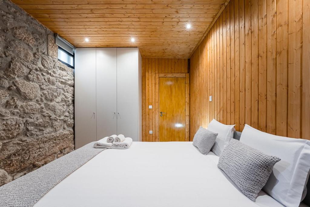 Postel nebo postele na pokoji v ubytování GuestReady - Casas de Fralães 3