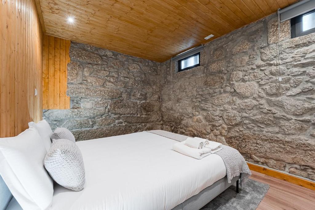Postel nebo postele na pokoji v ubytování GuestReady - Casas de Fralães 3