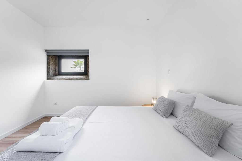 Cama ou camas em um quarto em GuestReady - Casas de Fralães 1