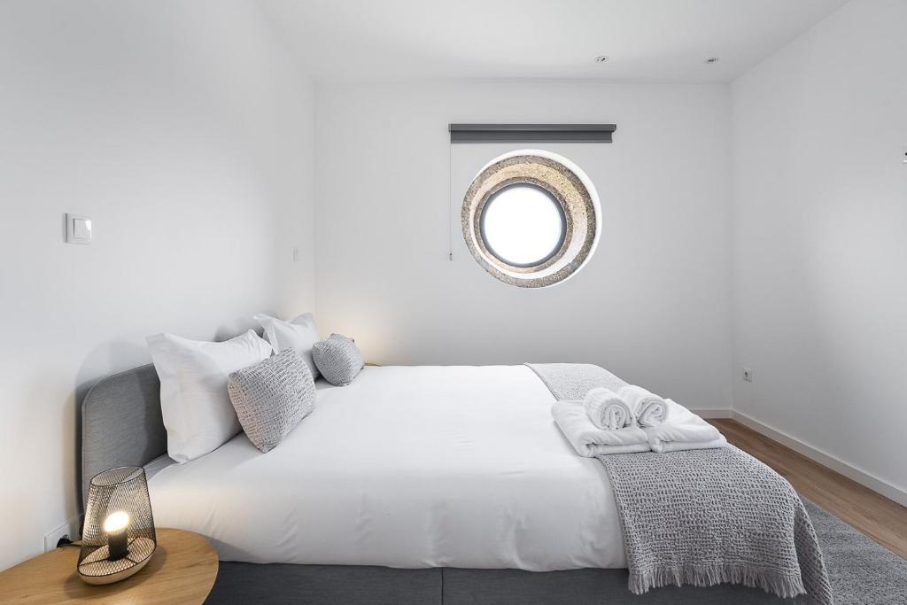 Cama ou camas em um quarto em GuestReady - Casas de Fralães 1