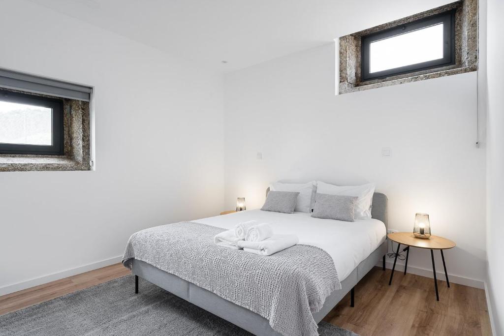 Cama ou camas em um quarto em GuestReady - Casas de Fralães 1