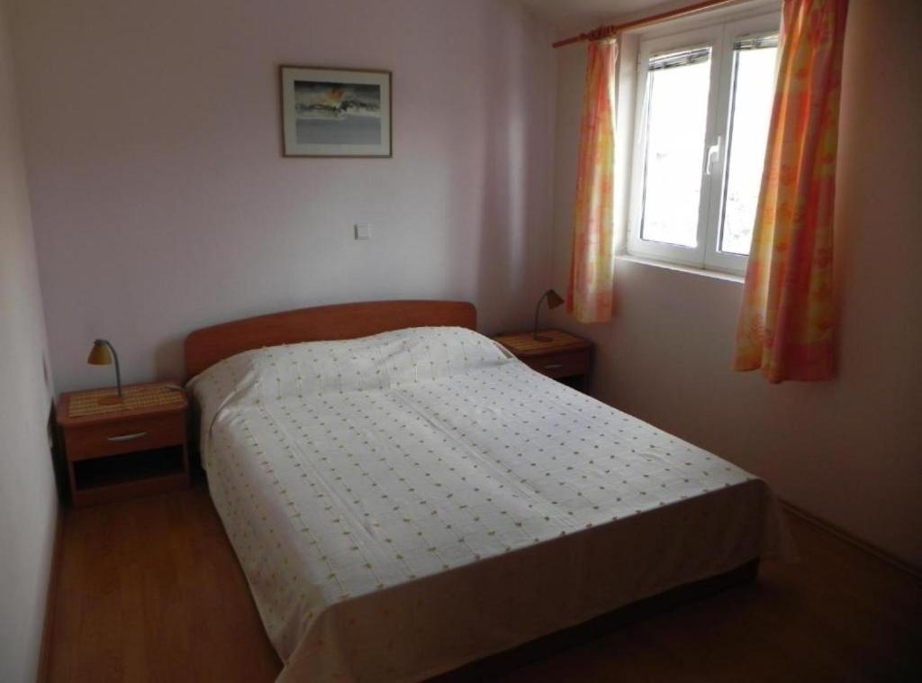 Postel nebo postele na pokoji v ubytování Apartments Trogrlić
