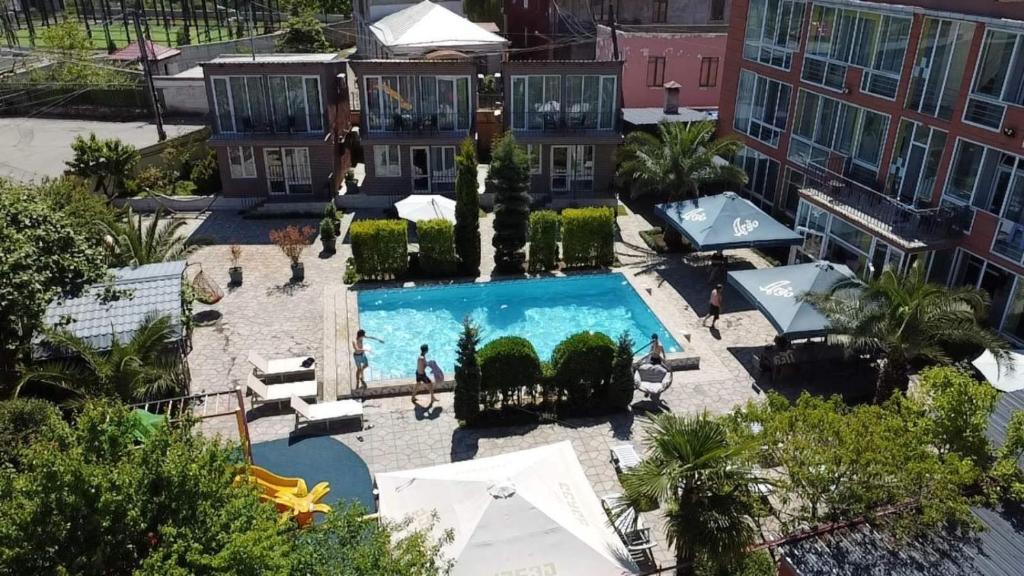 an overhead view of a swimming pool in a building at Hotel Buta in Batumi