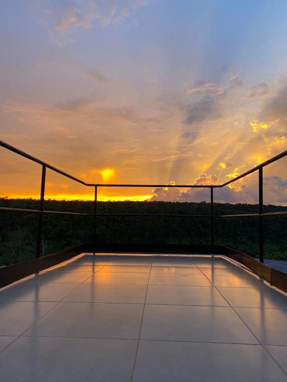 a view of the sunset from the balcony of a house at Container Home Py in Puerto Presidente Franco