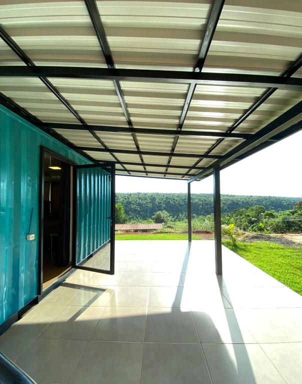 a view from the inside of a house with awning at Container Home Py in Puerto Presidente Franco