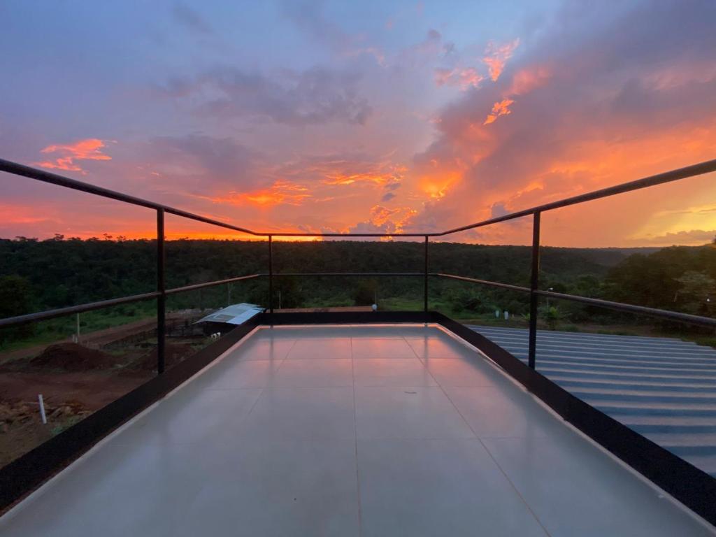 a view of a sunset from the top of a house at Container Home Py in Puerto Presidente Franco
