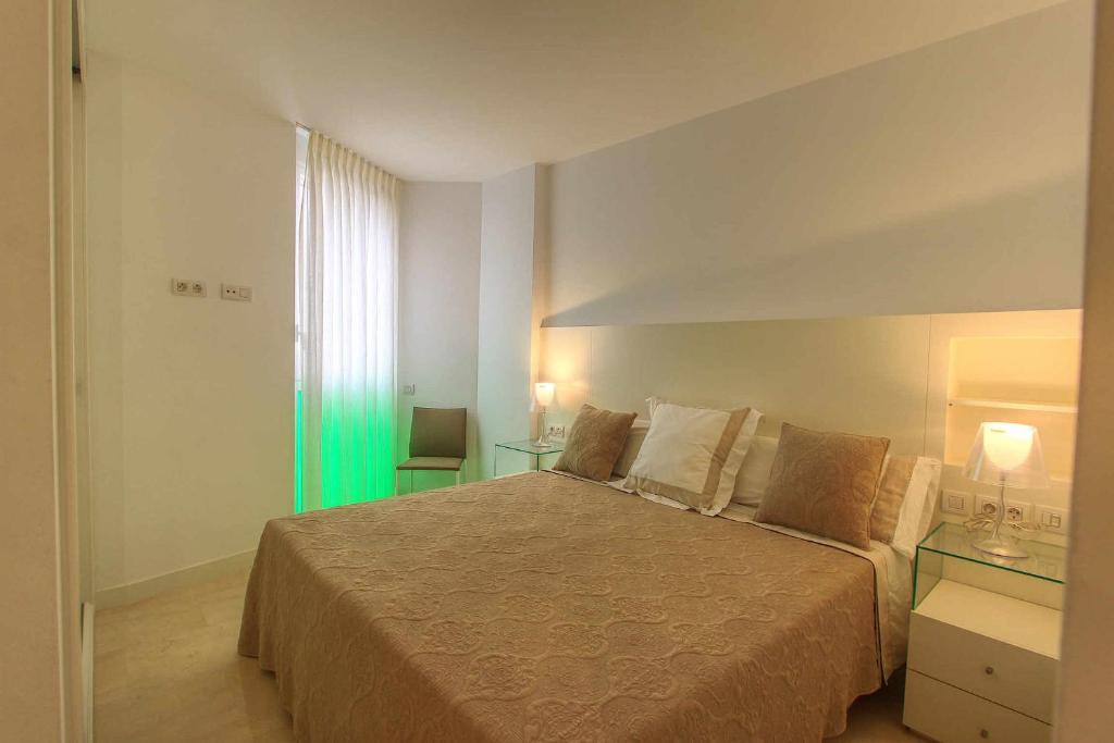 Posteľ alebo postele v izbe v ubytovaní 1092 marbella old town