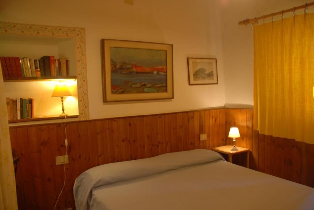Postel nebo postele na pokoji v ubytování Podere Conte Ràcani