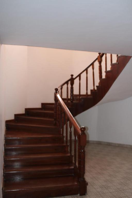 a staircase in a house with brown wooden steps at Wagaview place villa in Nairobi