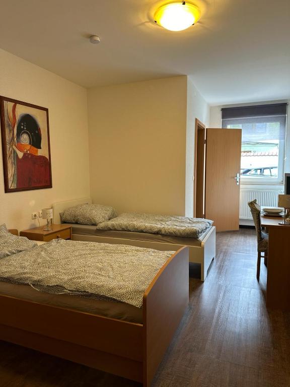 Säng eller sängar i ett rum på AR LIVING Rüsselsheim