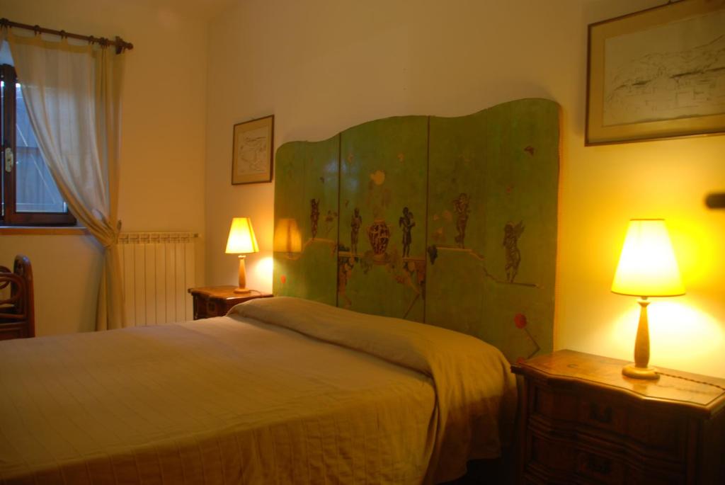 Postel nebo postele na pokoji v ubytování Podere Conte Ràcani