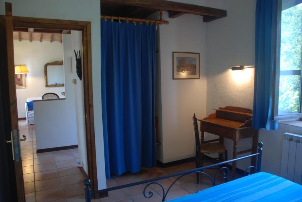 Postel nebo postele na pokoji v ubytování Podere Conte Ràcani
