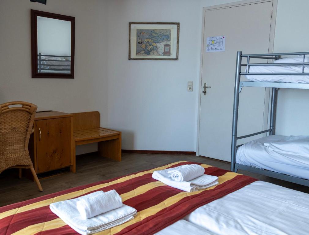 Postel nebo postele na pokoji v ubytování Hotel De Torenhoeve