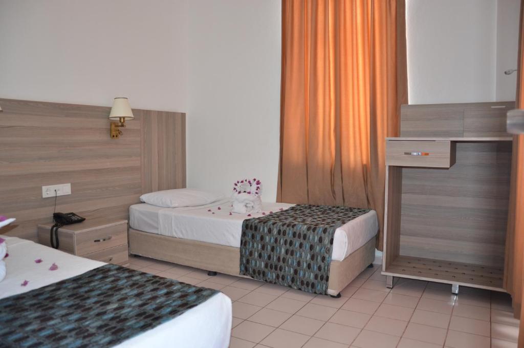 Krevet ili kreveti u jedinici u okviru objekta Sun Flower Apart Hotel