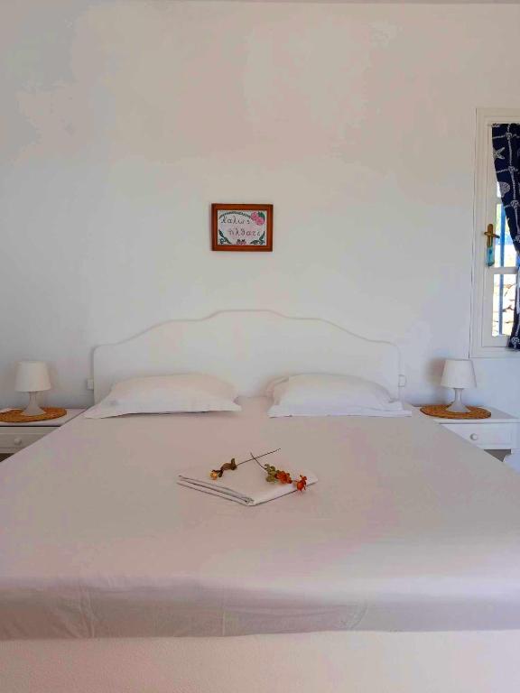 Postel nebo postele na pokoji v ubytování Georgia Rooms Milos