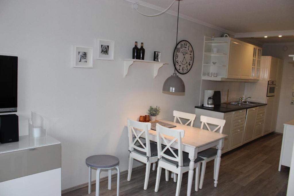 a kitchen and dining room with a table and chairs at Ferienwohnung Ostseeperle S152 in Brasilien