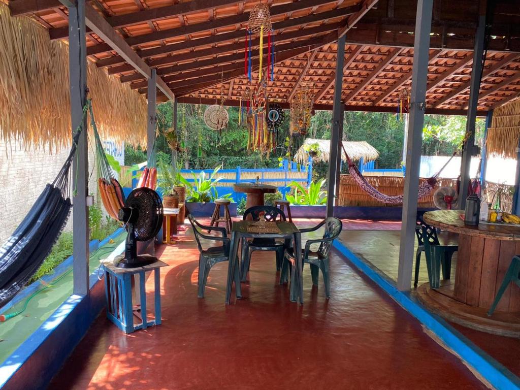 a room with a table and chairs in a house at CASA Botos de Alter in Alter do Chao
