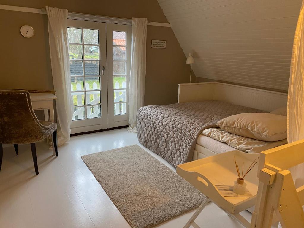 Postel nebo postele na pokoji v ubytování Sofie's Hus - Munkgaard