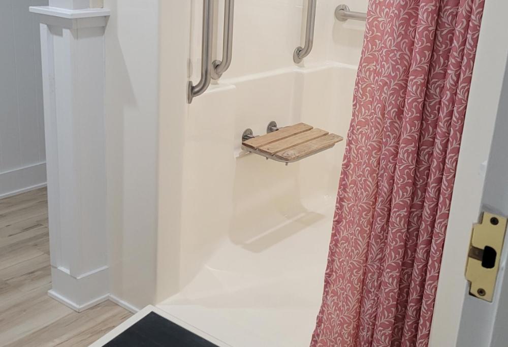 a bathroom with a shower with a shower curtain at Brandywine River Hotel in Chadds Ford