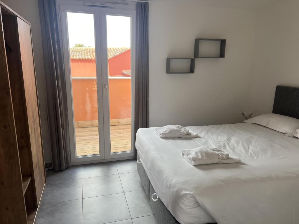 Posteľ alebo postele v izbe v ubytovaní Résidence hôtelière les hameaux de saint cyprien appartement 35 M2 1 chambre