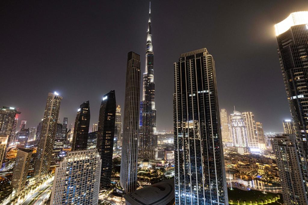 a nighttime view of a large city at night at Burj Crown - Spectacular Boulevard View, Opposite Dubai Mall in Dubai