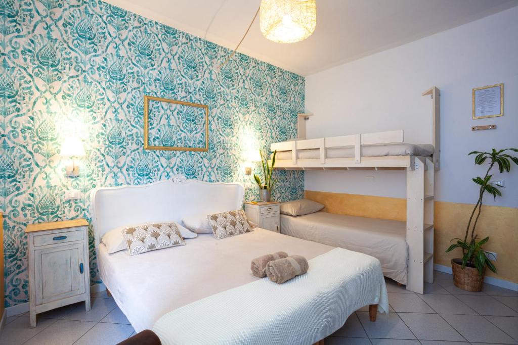 Postel nebo postele na pokoji v ubytování B&B La Volpina