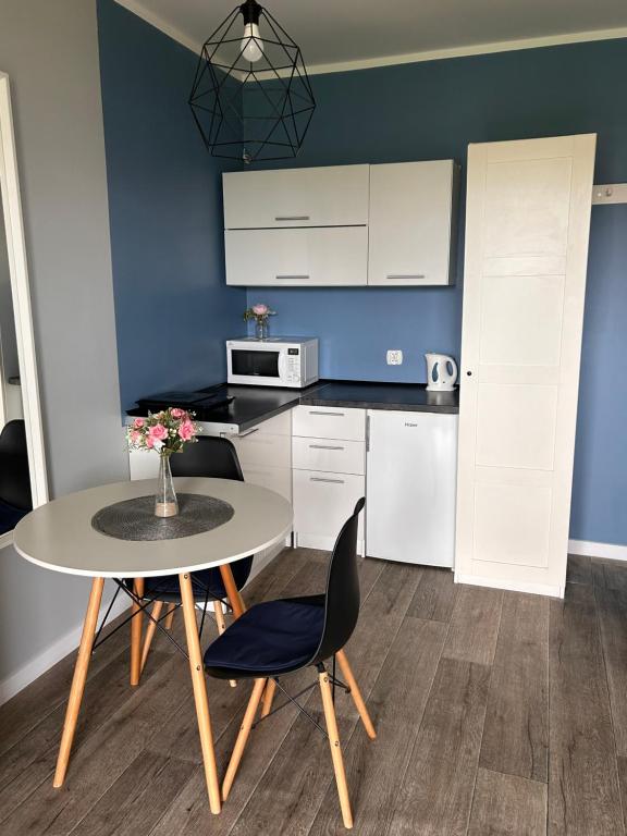 Kuchyňa alebo kuchynka v ubytovaní Resort EDEN domki, apartamenty i pokoje