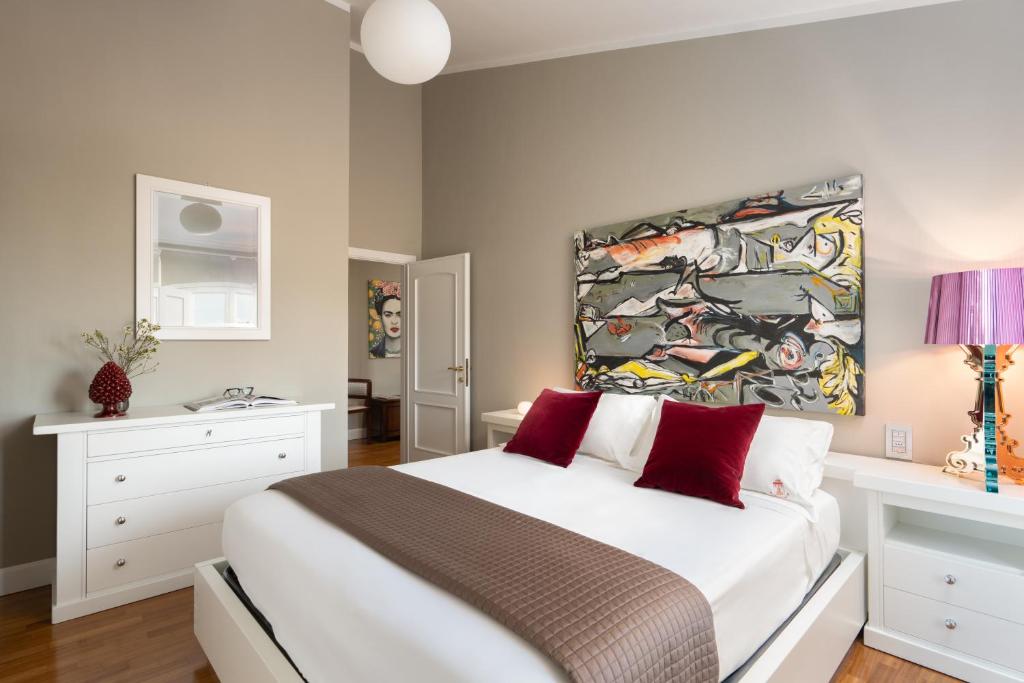 Postel nebo postele na pokoji v ubytování Torrigiani Apartments