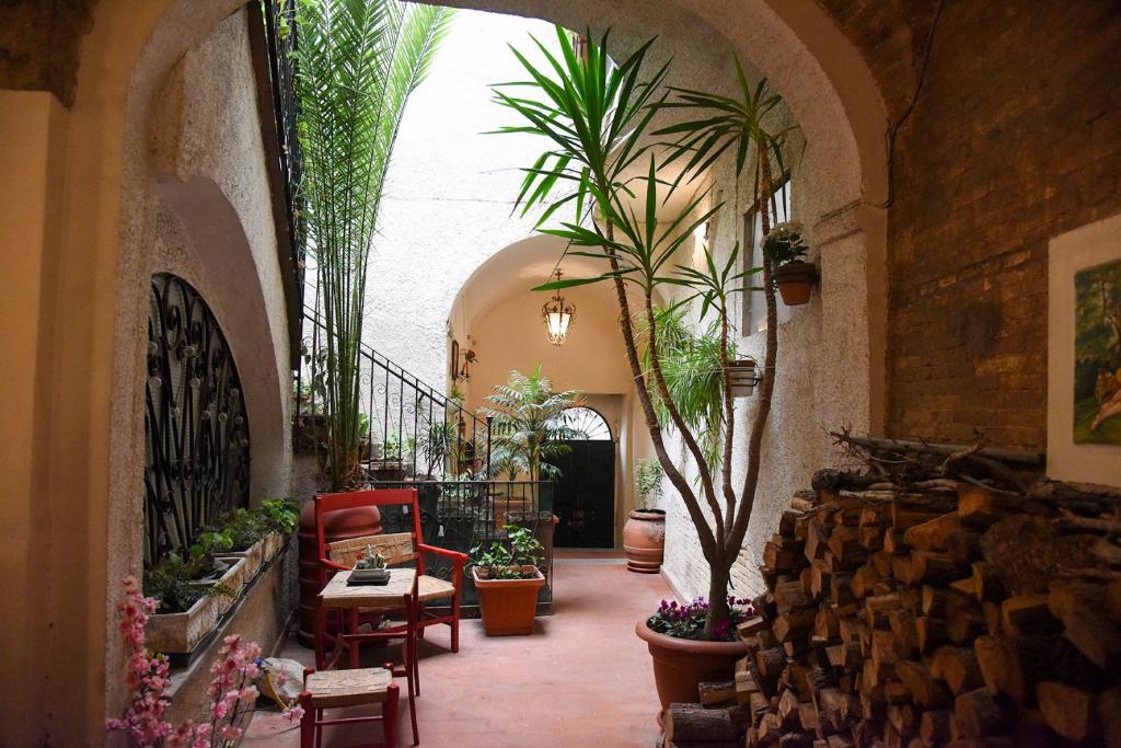 a hallway with potted plants in a building at Il Cortile nel Borgo in Lanciano