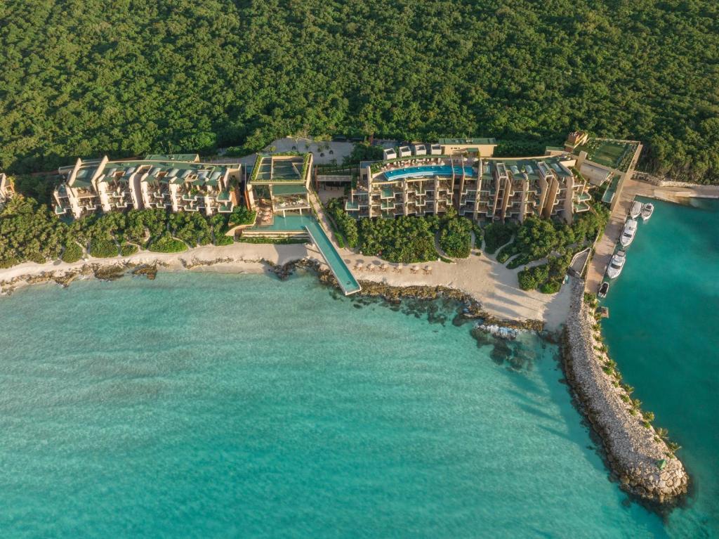 an aerial view of a resort on the beach at La Casa de la Playa by Xcaret- All Inclusive Adults Only in Playa del Carmen