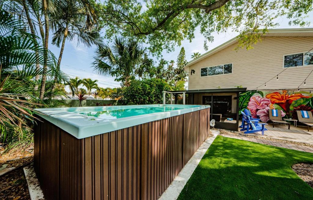 a swimming pool in the backyard of a house at Snook Haven in Clearwater Beach