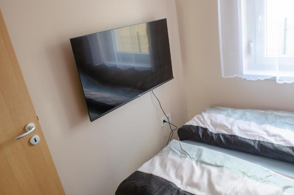 Postel nebo postele na pokoji v ubytování Bánki Vendégház