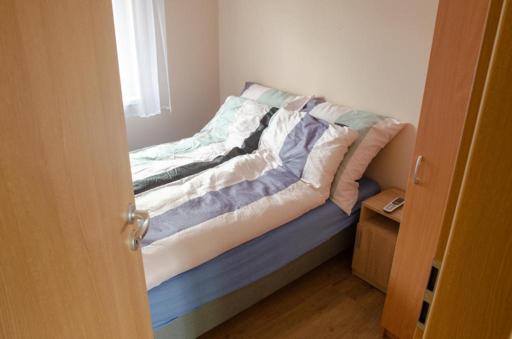 Postel nebo postele na pokoji v ubytování Bánki Vendégház