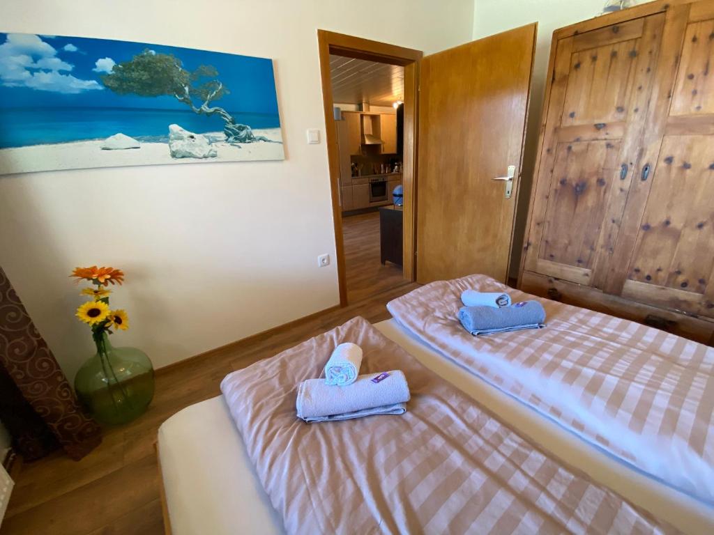 Postel nebo postele na pokoji v ubytování Seewohnung Weiss