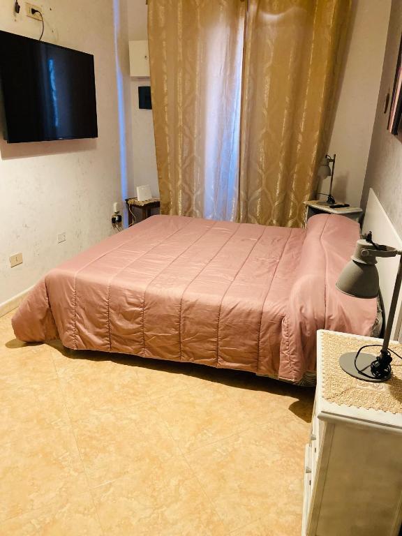 Televízia a/alebo spoločenská miestnosť v ubytovaní Casa vacanza Giusi