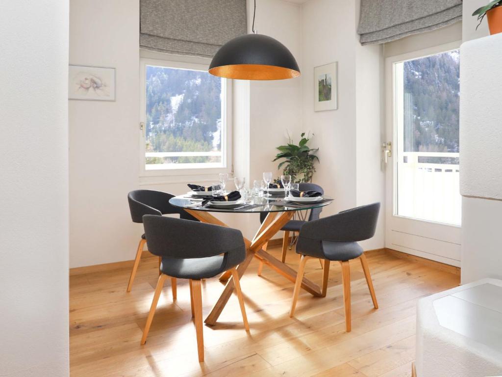 a dining room with a table and chairs at Apartment Alpes et Lac 40 by Interhome in Champex