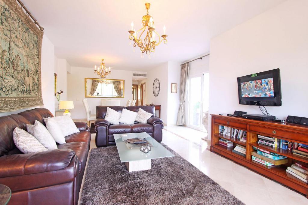 A television and/or entertainment centre at 1126 BEACHFRONT HIGH STANDARD APARTMENT WITH TERRACE