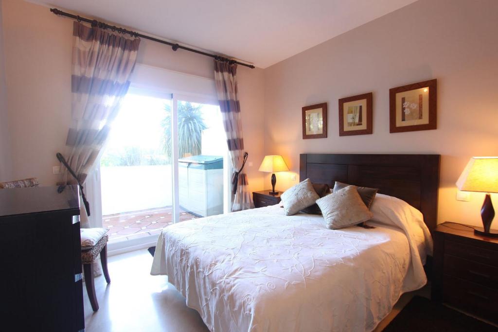 A bed or beds in a room at 1126 BEACHFRONT HIGH STANDARD APARTMENT WITH TERRACE